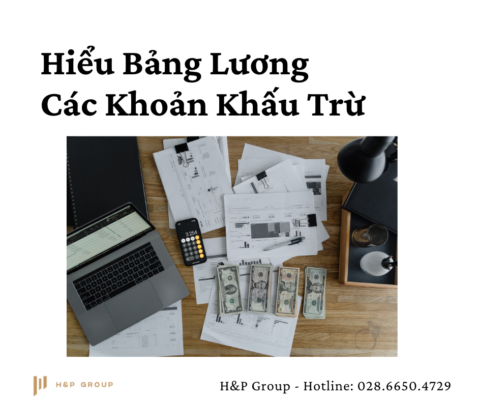 a laptop and money on a table
